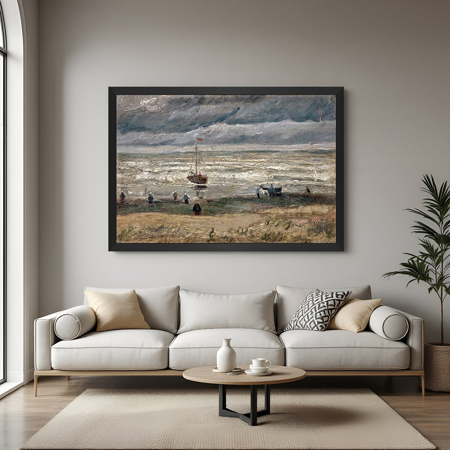 Black-framed vintage wall art showing beachgoers, boat, sea waves, and dramatic clouds—classic canvas