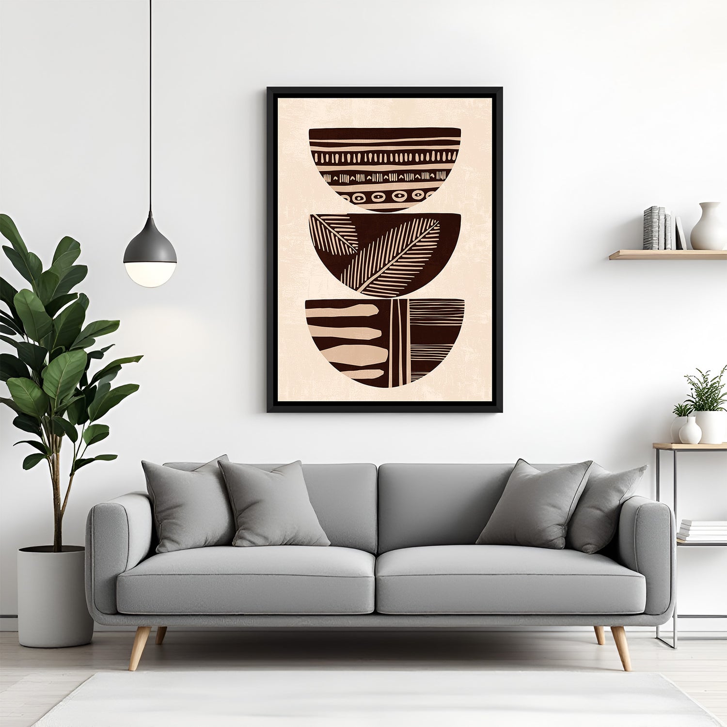 Black frame wall art showing brown-toned stacked bowls with printed bohemian accents