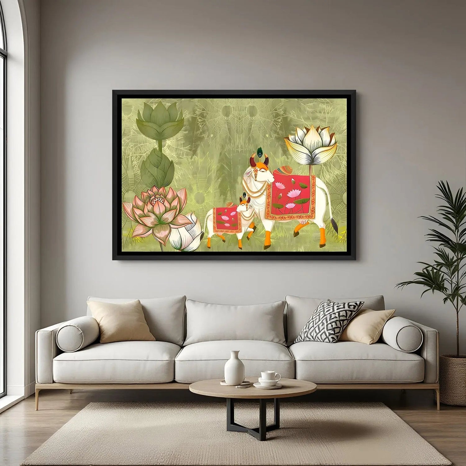 Pichwai Kamadhenu artwork with pink decorative textiles and lotus flowers in elegant black floater frame