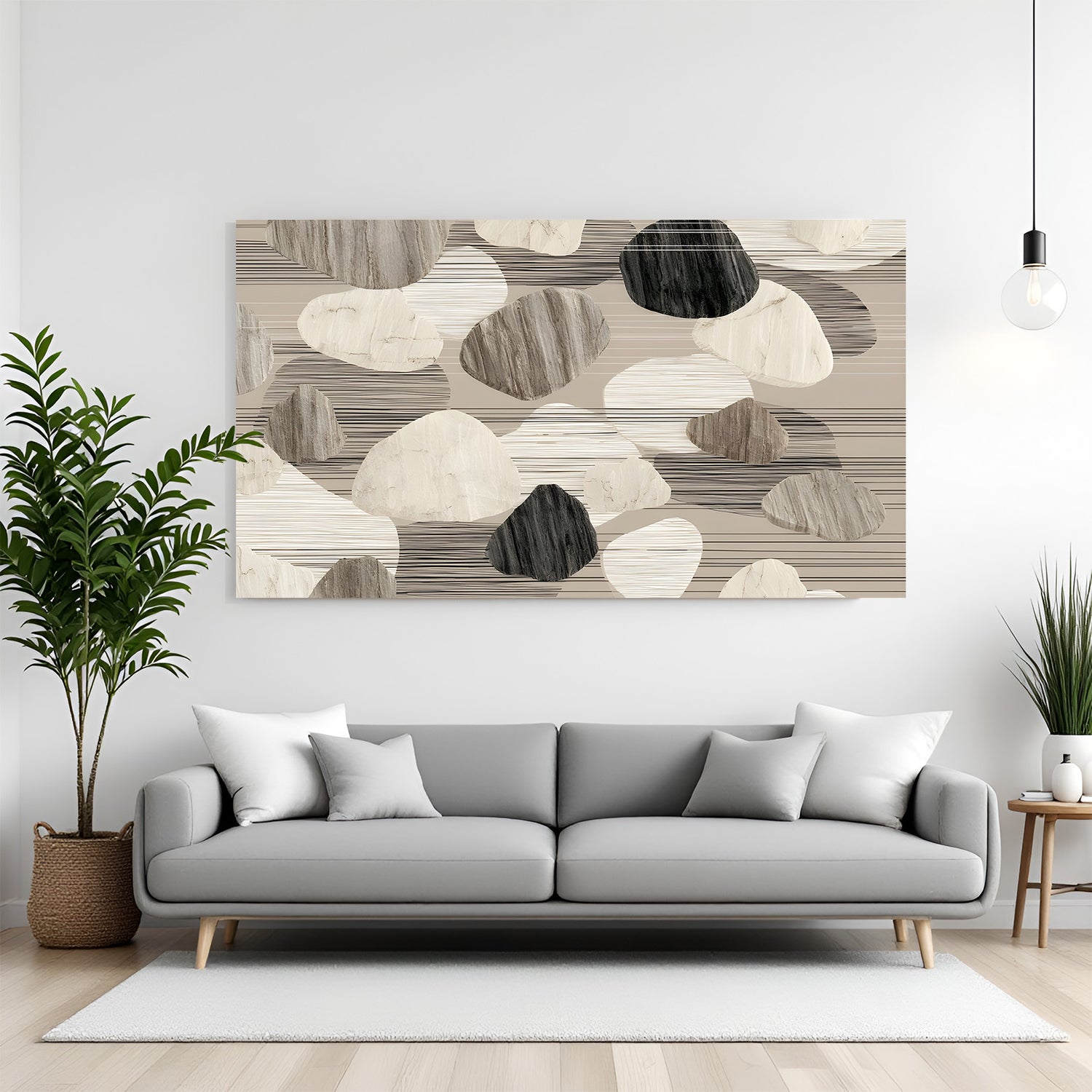 Neutral abstract canvas wall art in beige and grey tones with pebble texture design, displayed above a sofa in a modern living room with canvas wrapped finish