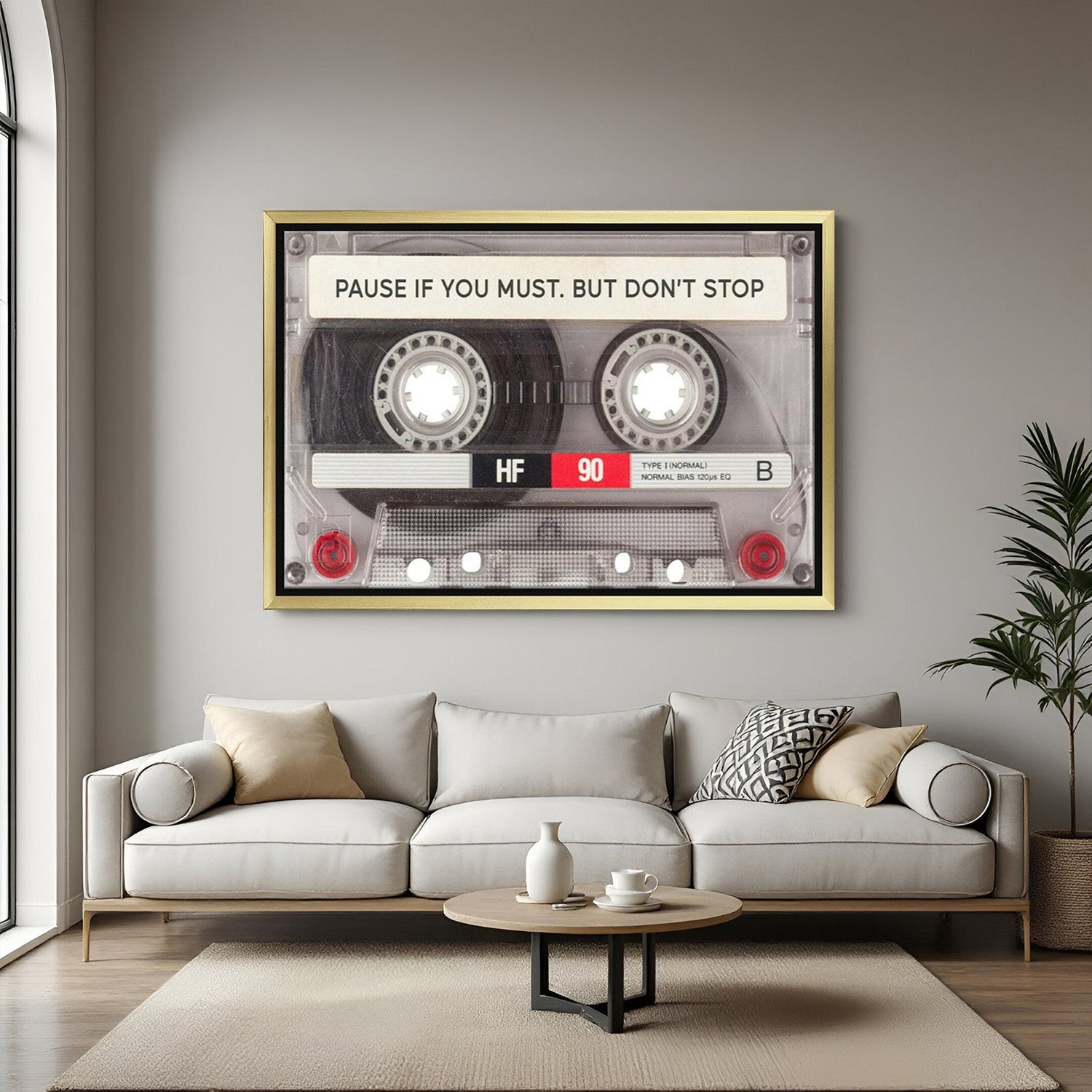 Inspiring canvas print with a golden floater frame and the quote