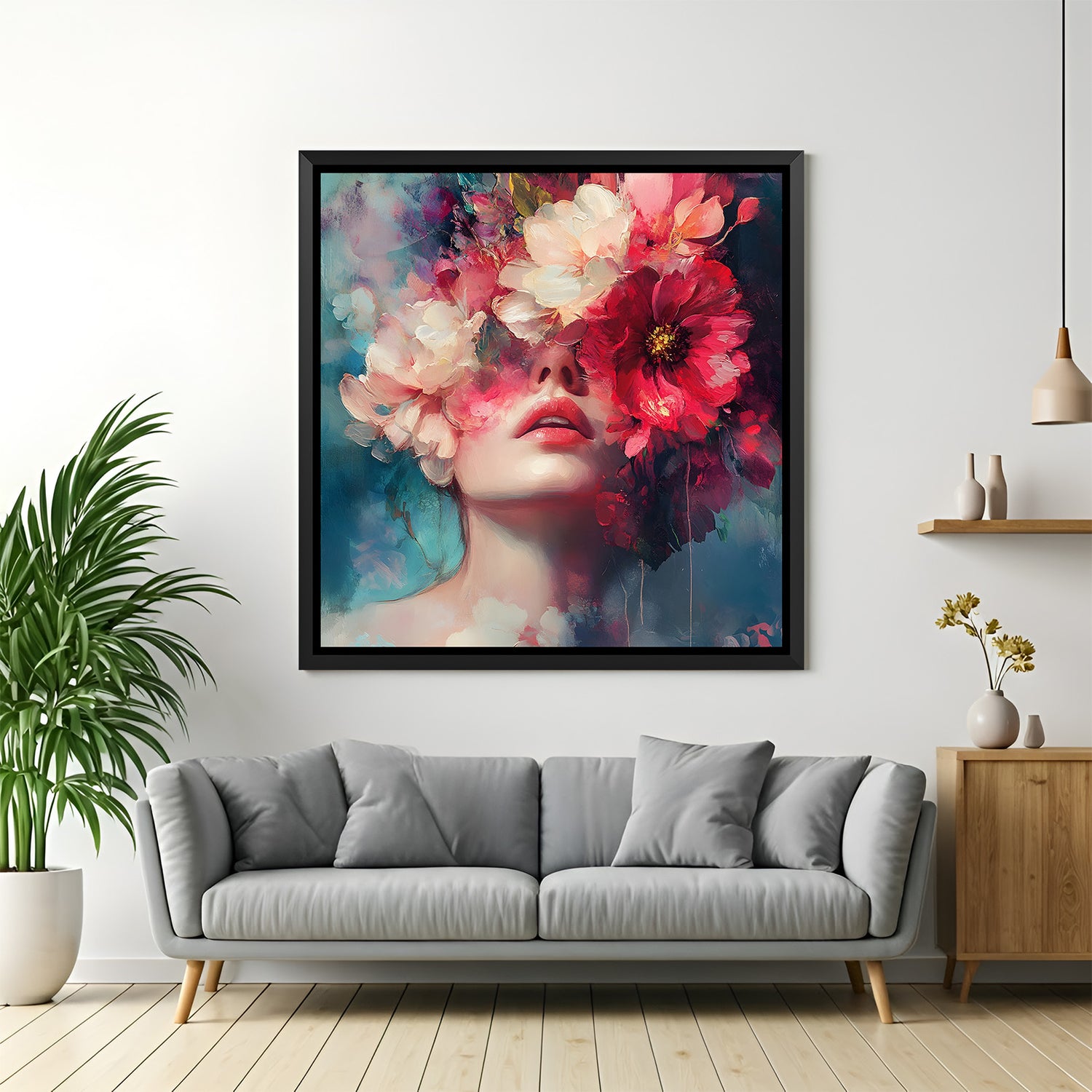 Luxury floral portrait painting in sleek black floater frame with bold crimson and ivory flowers against teal background.