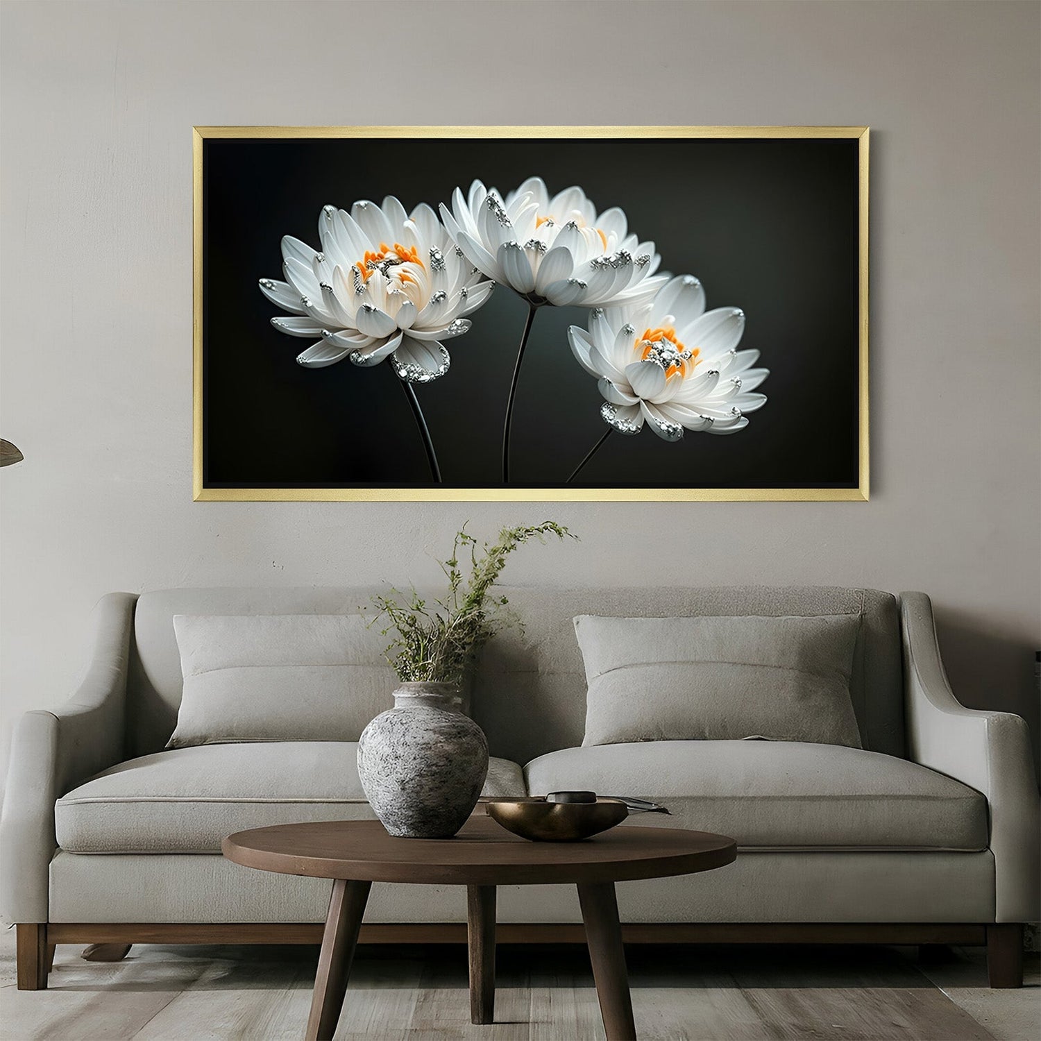 Golden-framed wall art of three painted white flowers on black canvas, designed for luxurious and sophisticated interior themes