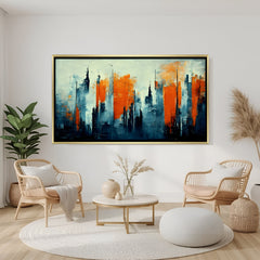 Abstract cityscape canvas wall art with blue and orange tones in golden floater frame displayed in elegant modern living room decor