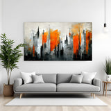 Modern abstract cityscape canvas wall art with orange and grey skyline displayed in living room decor canvas wrap