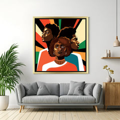 Golden-framed artwork of three African figures, designed in cultural painting style for elegant and ethnic room decor