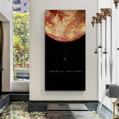 Astronaut hanging on a planet inside a wallet, frameless canvas with Dream Big, Hold Tight quote