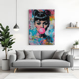 Modern canvas print of Audrey Hepburn blowing bubble gum, combining timeless elegance with quirky pop culture style for fashionable home and office wall decor