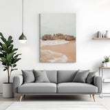 Canvas wall art of a calm beach with ocean waves and soft sand, creating a peaceful and airy look for home or office walls