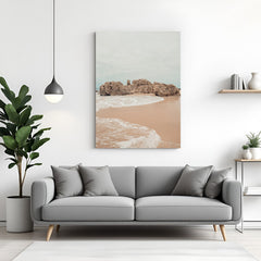 Canvas wall art of a calm beach with ocean waves and soft sand, creating a peaceful and airy look for home or office walls
