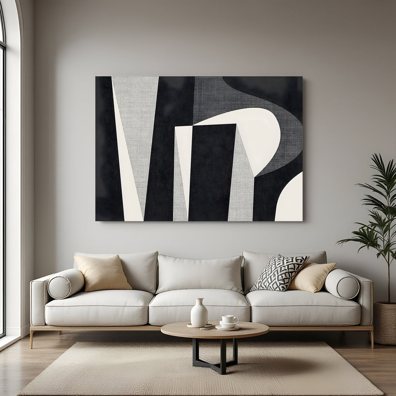 Modern black and beige abstract geometric canvas wall art displayed above sofa in minimalist living room