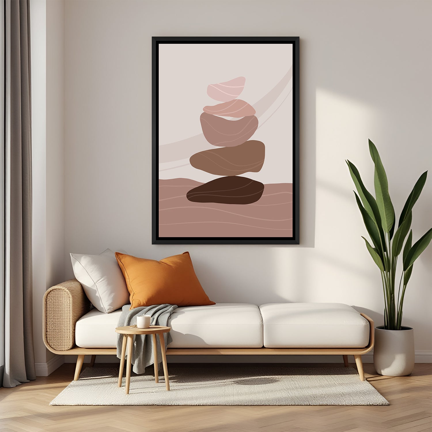 Black framed boho canvas with different shaped pebbles stacked in neutral tones on soft backdrop