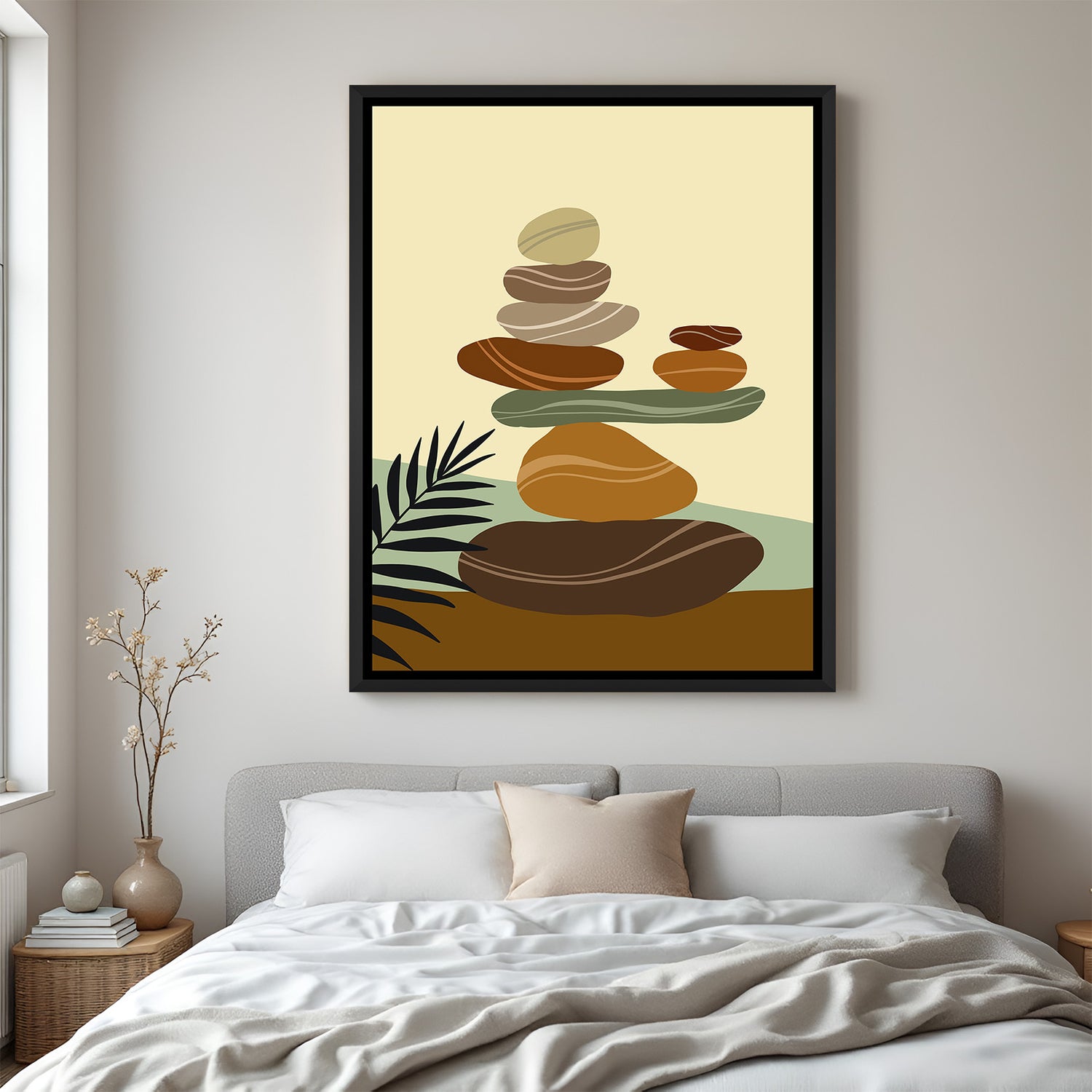 Black frame wall art with soft pastel pebbles stacked vertically in calm, minimal boho style