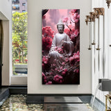 Vertical Buddha meditation wall art surrounded by soft pink blossoms.