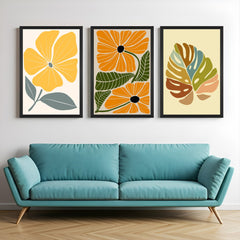 Boho wall art trio with floral and leaf prints in warm tones – includes one flower, two flowers, and leafy minimal design for nature lovers