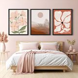 Bohemian wall art set of 3 featuring pastel pink flower cluster, desert landscape, and floral print – ideal for earthy and calming interiors