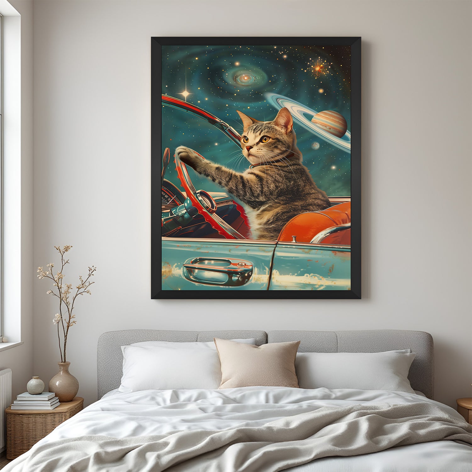 Whimsical cat-in-space wall art in black frame, showing feline astronaut driving through a cosmic world—perfect for modern quirky wall decor lovers