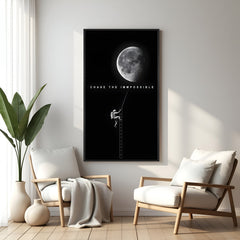 Space motivational wall art with astronaut climbing moon and Chase the Impossible quote in black floater frame