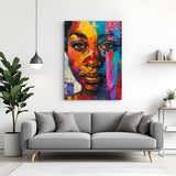Canvas wall art of African girl’s face with colorful painted strokes in red, blue, green, yellow, and orange for vibrant ethnic decor