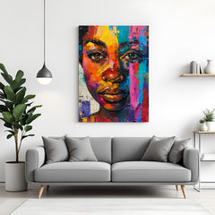 Canvas wall art of African girl’s face with colorful painted strokes in red, blue, green, yellow, and orange for vibrant ethnic decor