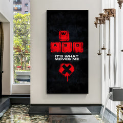 Driven by Pixels PC gaming canvas wall art featuring It's What Moves Me quote and modern gaming setup in premium canvas wrapped frame