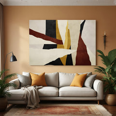 Modern earth tone abstract canvas wall art in rust, black, and beige displayed above sofa in contemporary living room