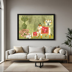 Pichwai Kamadhenu artwork with pink decorative textiles and lotus flowers in elegant black floater frame