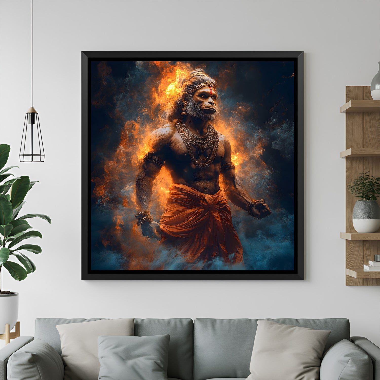 Fiery Hanuman Ji wall art in black floater frame mounted in contemporary living room interior.