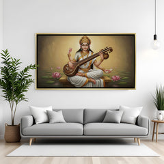 Goddess Saraswati veena wall art in elegant golden floater frame displayed in modern interior decor.
