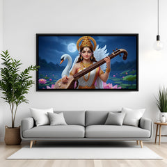 Goddess Saraswati wall art in black floater frame mounted in elegant living room interior decor.