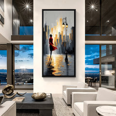 Modern cityscape artwork with woman walking in black floater frame featuring golden reflections and elegant urban style