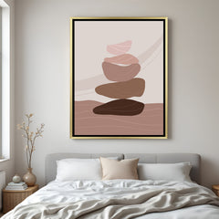 Golden floater canvas art featuring abstract pebble stack in calming natural earthy colors