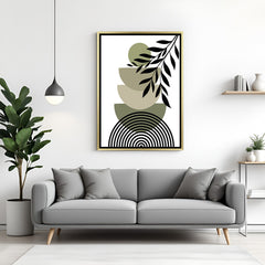 Golden frame wall art with stacked earthy forms, green circle and minimal leaf stem in boho style