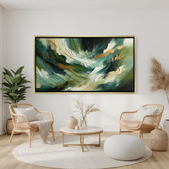 Green abstract canvas wall art with gold accents and flowing design in golden floater frame displayed in elegant modern living room decor