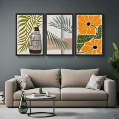 Set of 3 bohemian canvas prints with traditional flower pot, minimal leaves, and vibrant orange floral – perfect for modern natural interiors