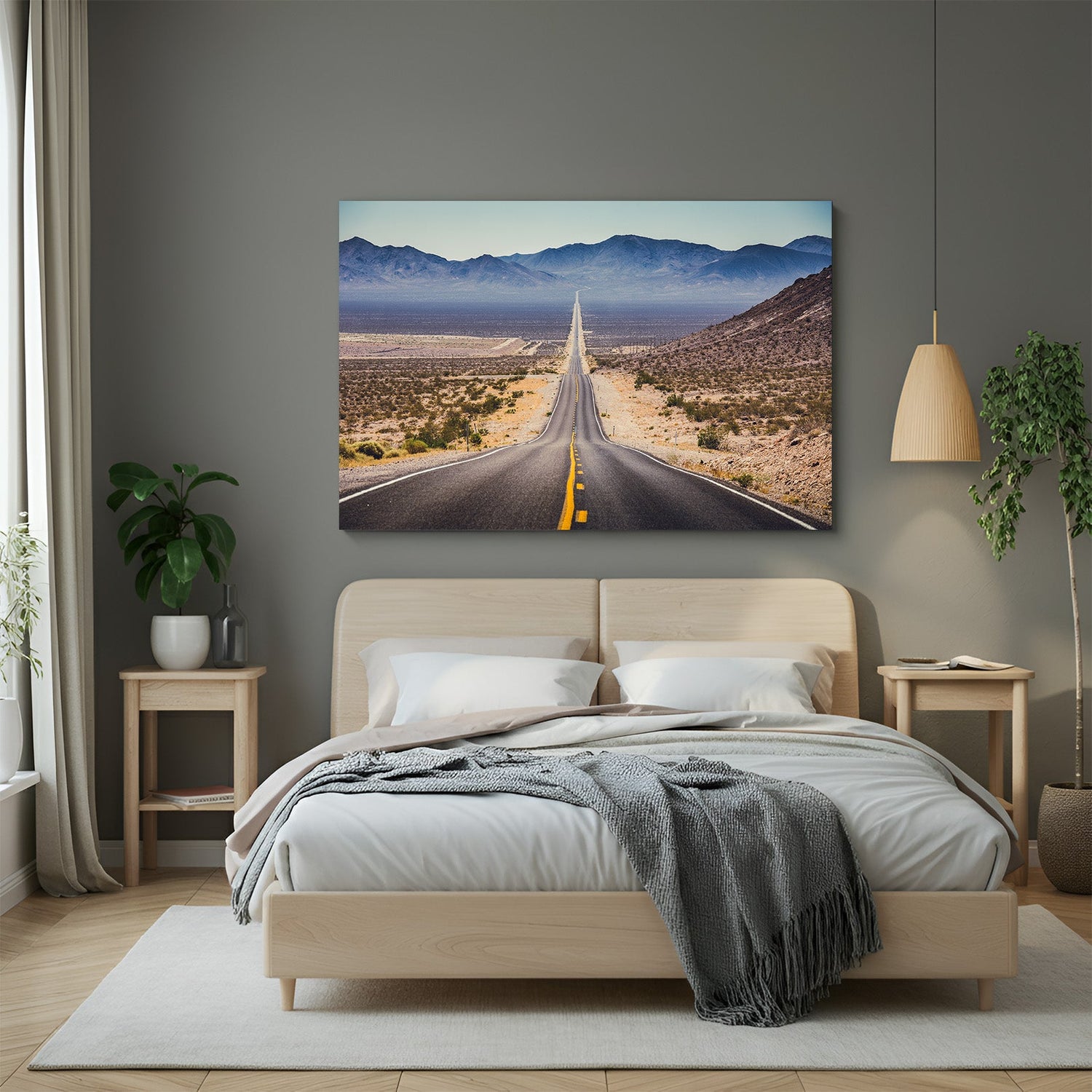 Canvas wall art showing a long road vanishing into the horizon, with desert landscape on both sides, creating a bold and open travel-inspired decor look