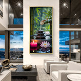 Relaxing Zen canvas painting with stacked stones, glowing candle, and lotus blossoms in luxurious golden floater frame