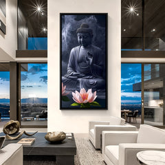 Dark toned Buddha canvas art in black frame with lotus flower foreground.