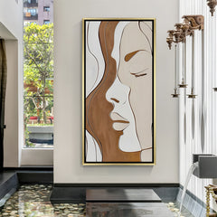 Luxury abstract female face canvas artwork in golden floater frame with elegant neutral tones