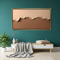 Minimalist abstract canvas wall art in warm neutral tones with golden floater frame displayed in elegant modern living room decor