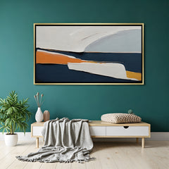 Modern abstract canvas wall art in navy blue and beige tones with golden floater frame displayed in elegant contemporary living room decor