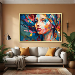 Multicolor abstract canvas wall painting of a female face with golden floater frame – modern and vibrant artwork for stylish and expressive interiors
