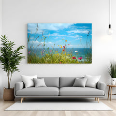 Canvas wall art featuring green grass, tiny wildflowers, blue sea, and a clear sky—perfect for peaceful and natural interior decor