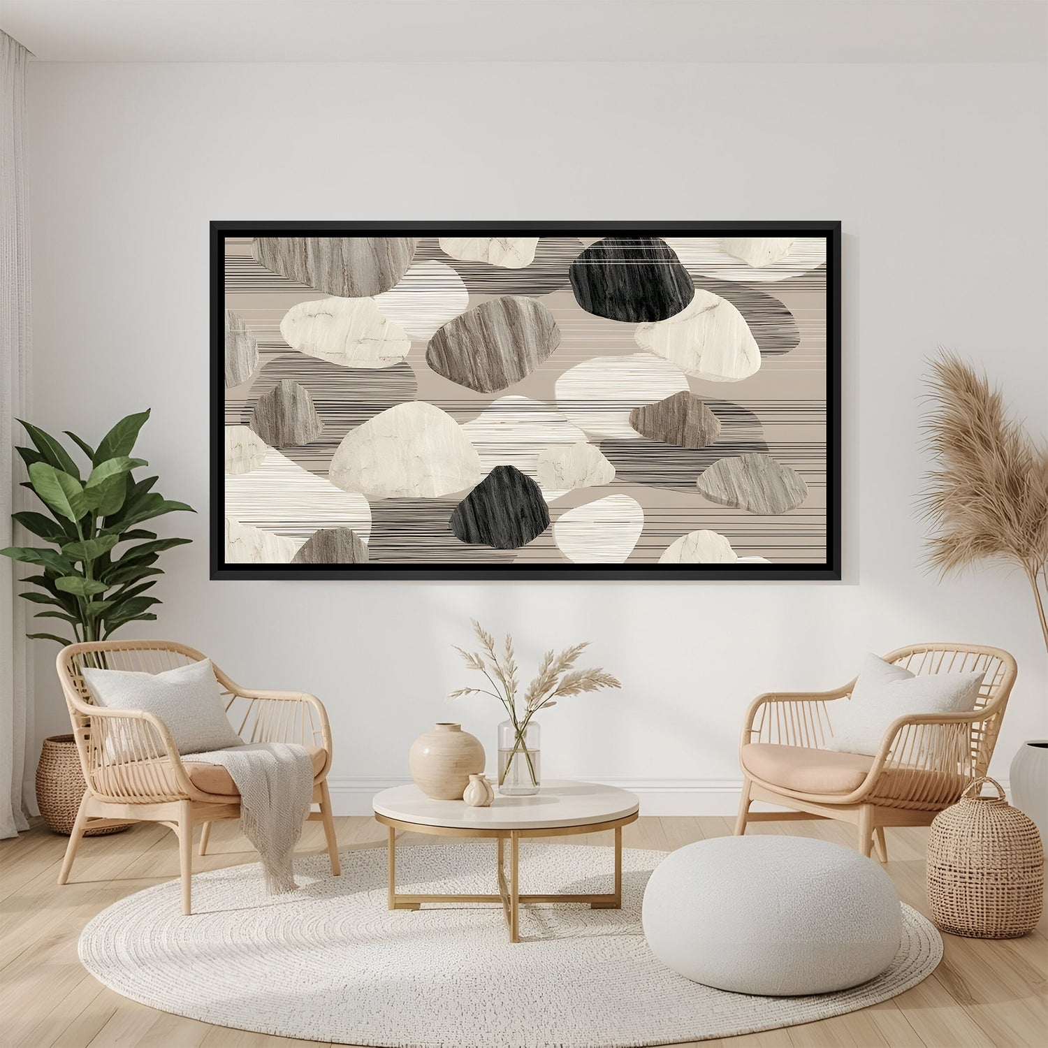 Neutral abstract pebble canvas wall art in beige and grey tones with black floater frame, styled above sofa in a contemporary minimalist living room