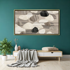 Neutral abstract canvas wall art in beige and grey tones with golden floater frame, elegant modern artwork displayed in a luxury living room setting