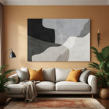 Neutral abstract canvas wall art with organic shapes in beige grey and black tones in modern living room