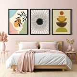 Set of 3 boho wall art prints featuring pastel floral abstract, black sun rays, and multi-colored minimal shapes – perfect for stylish modern interiors