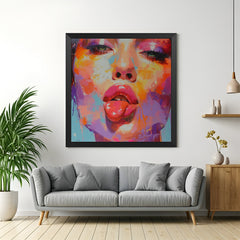 Black-framed modern art canvas showing a woman playfully sticking her tongue out—perfect for edgy wall art lovers and fun, fashion-forward interior spaces