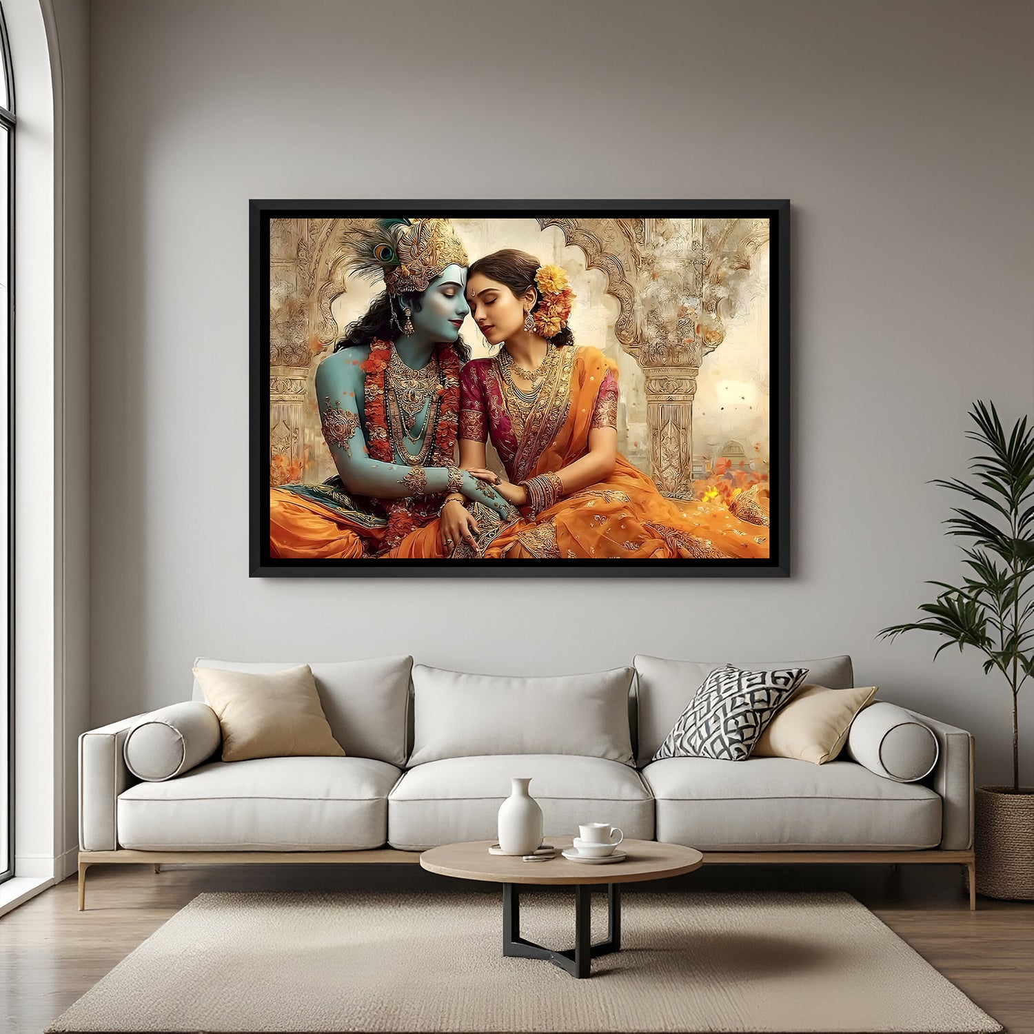 Framed Radha Krishna wall art displayed above beige sofa in warm interior.
