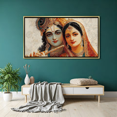 Elegant Radha Krishna wall art in gold frame with soft ivory floral background.